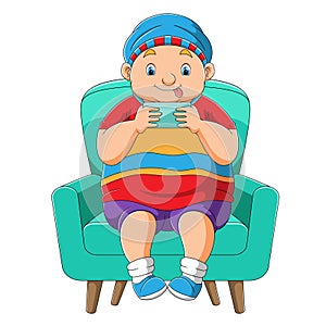 The little boy is playing the game on the hand phone