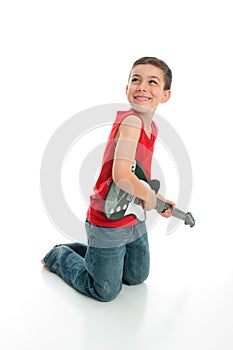 Little boy playing guitar