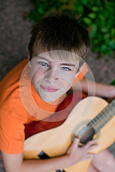 Little boy playing guitar