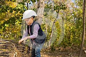 Little boy playing in a hardhat