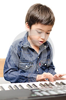 Little boy playing keyboard