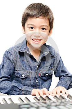 Little boy playing keyboard
