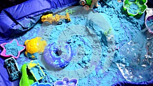 Little boy Playing with Kinetic Sand at Home Early Education Preparing for School Development Children Game. digs sand