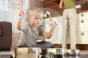 Little boy playing in kitchen