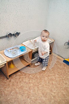 Little boy playing kitchen