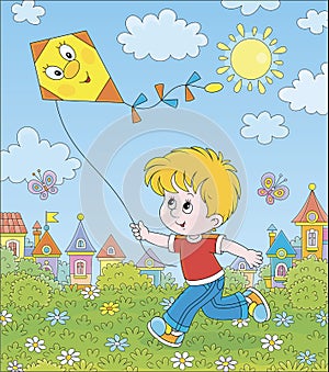 Little boy playing with a kite