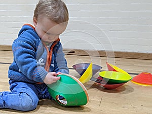 Little boy playing with marker cones