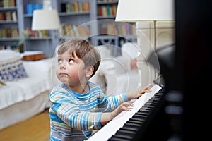 Little boy playing piano