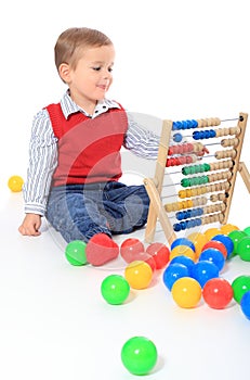 Little boy playing with sliderule
