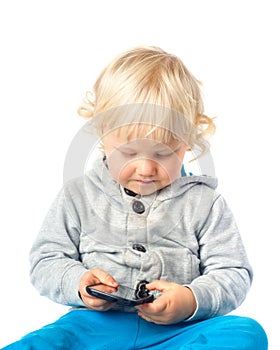 Little boy playing with smart phone