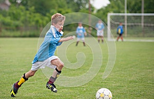 Little Boy playing soccer