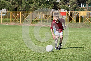 Little Boy playing soccer