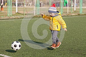 Little boy playing with soccer or football ball. sports for exercise and activity