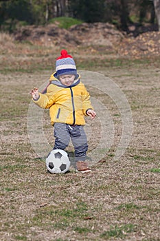 Boy playing with soccer or football ball. sports for exercise and activity