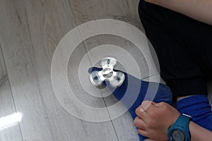 Little boy playing with a spinner