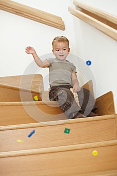 Little boy playing on stairs