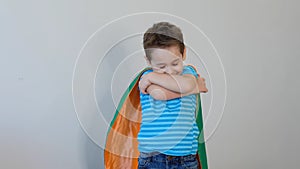 Little boy playing a superhero. Kid in an Superhero`s costume. happy child. green mask, nature care concept