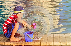 Little boy playing in swimming pool at beach