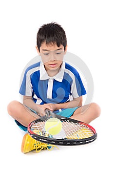 Little boy playing tennis racket and tennis ball in hand