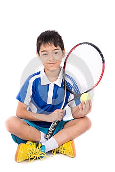 Little boy playing tennis racket and tennis ball in hand