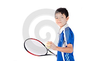 Little boy playing tennis racket and tennis ball in hand