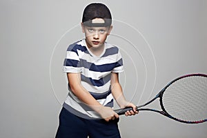 Little Boy Playing Tennis. Sport Child with tennis racquet