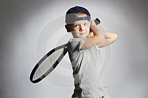 Little Boy Playing Tennis. Sport kids.Child with Tennis Racket