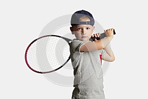 Little Boy Playing Tennis. Sport kids.Child with Tennis Racket
