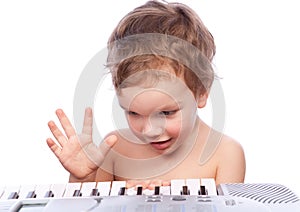 Little boy plays piano