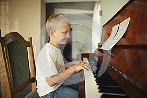 Little boy plays piano