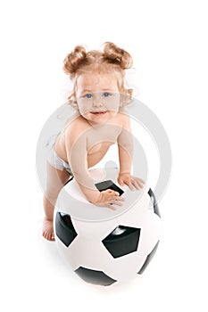 Little boy plays with a soccer ball