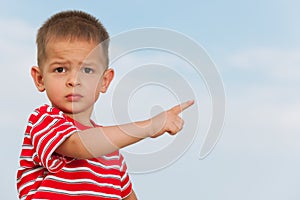 Little boy pointing direction