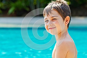 Little boy by the pool