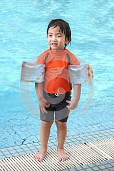 Little boy by the pool