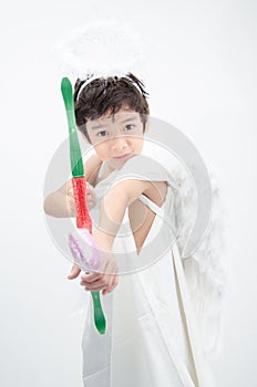 Little boy portrait pretend as cupid with wing