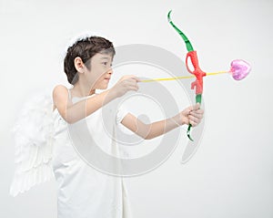 Little boy portrait pretend as cupid with wing