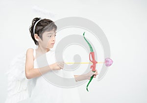 Little boy portrait pretend as cupid with wing