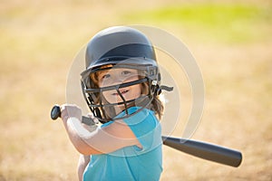 Little boy posing with a baseball bat. Portrait of kid playing baseball.