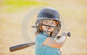 Little boy posing with a baseball bat. Portrait of kid playing baseball.