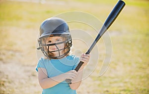 Little boy posing with a baseball bat. Portrait of kid playing baseball.