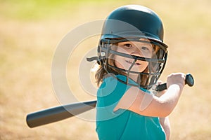 Little boy posing with a baseball bat. Portrait of kid playing baseball.