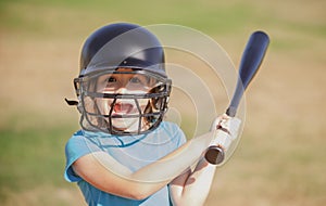 Little boy posing with a baseball bat. Portrait of kid playing baseball.