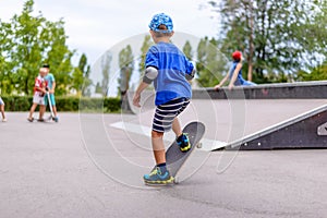 Little boy practicing on his skateboard