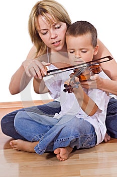 Little boy practicing the violin