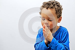 Little boy praying to God