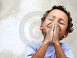 Little boy praying to God