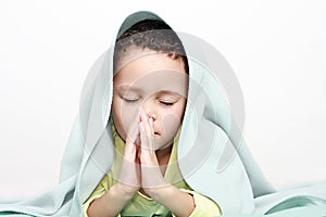 Little boy praying to God