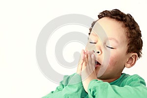 Little boy praying to God