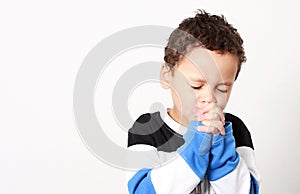 Little boy praying to God