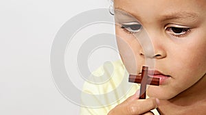 Little boy praying to God with hands held together stock photo